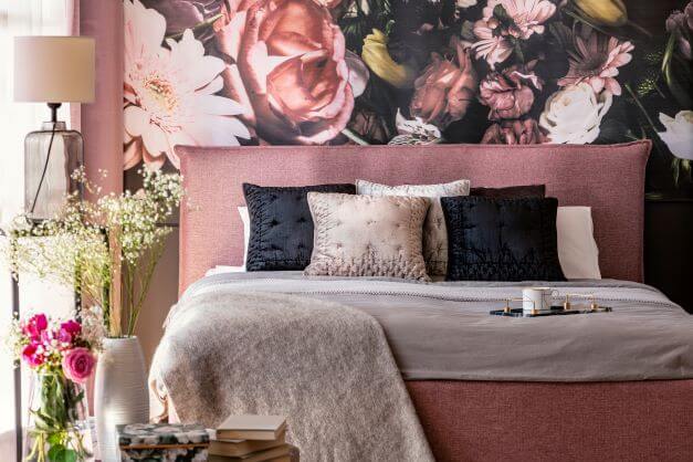 Bright patterned wallpaper in master bedroom